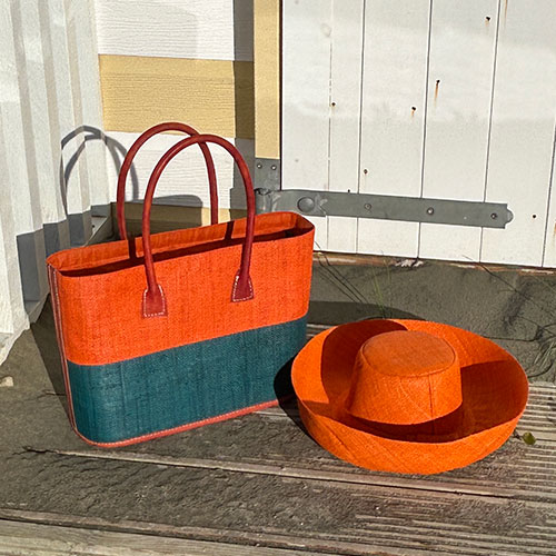 Monique Two Tone raffia bag in orange and turquoise with a Mimosa raffia Hat in orange